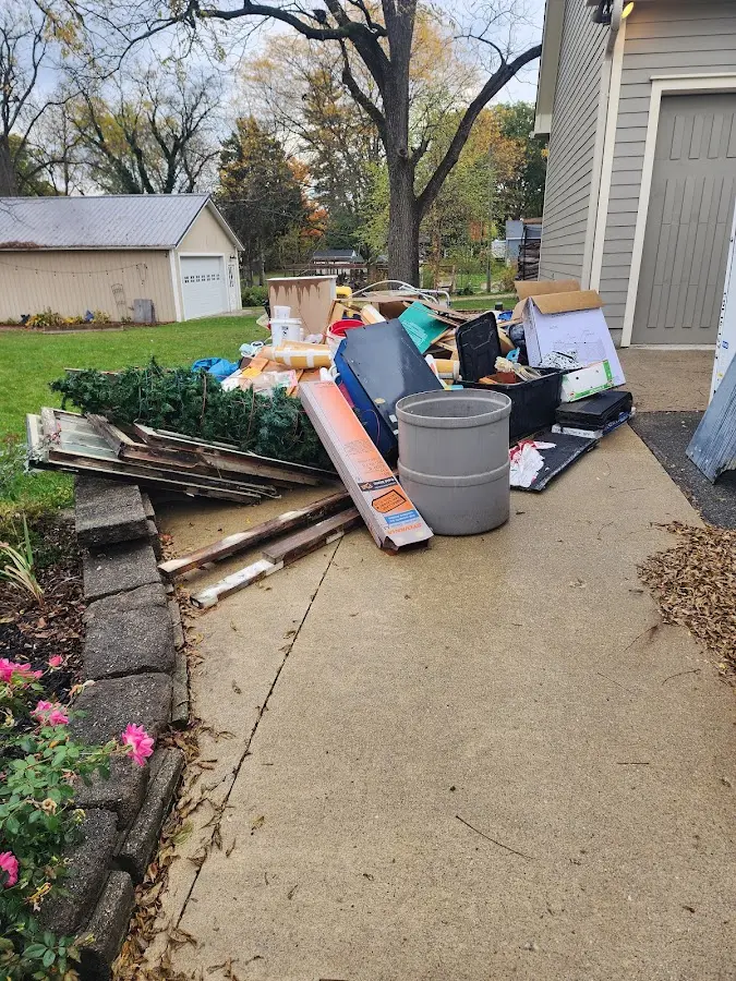 Dumpster being loaded with debris for 30 Yard Dumpster Rental in Joliet